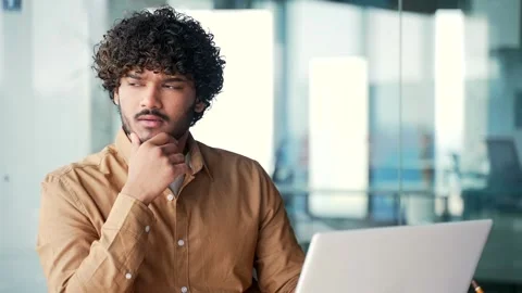 Close up. Thoughtful employee thinking about a solution to a problem while  Stock Footage 244009115