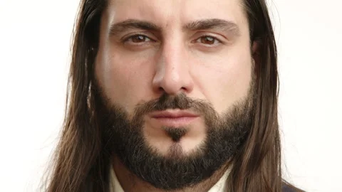 Close-up of Thoughtful Man with Long Dark Hair and Beard Stock Footage 267374792