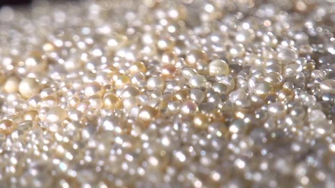Close up of thousands of Pearls with a camera pan movement Stock Footage 104485309