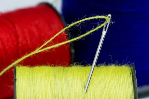 Close up Thread roller and Sewing Needles. Stock Photos
