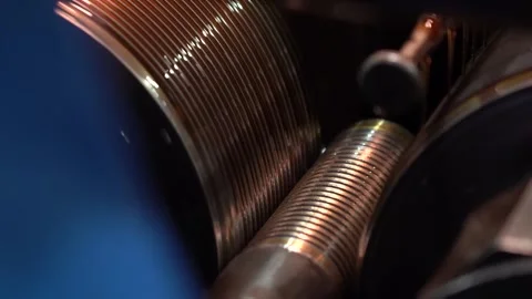 Close up of a thread rolling die forming spiral threads on a metal rod Stock Footage 345405070