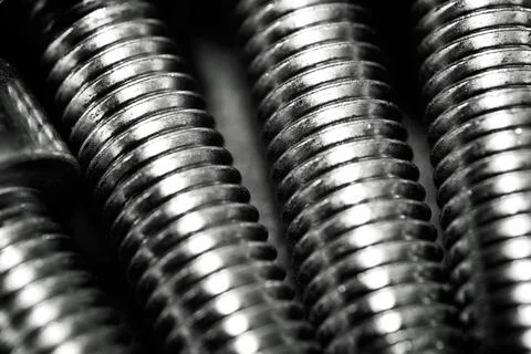 Close-up of the thread of some metal screws Фото