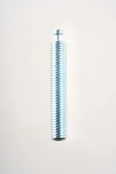 Close-up of a threaded bolt on white background Stock-Fotos