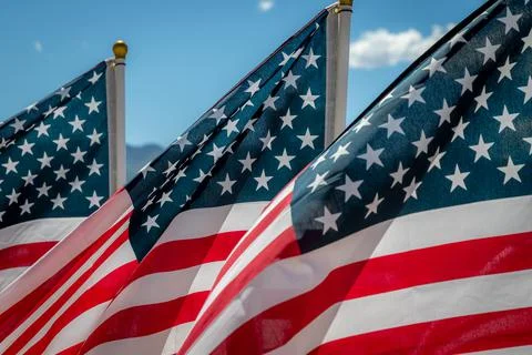 Close Up of Three American Flags Blowing in the Wind Foto stock
