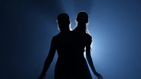 Close-up of three attractive ballerinas dancing elements of ballet. Slow motion Stock Footage 111205098