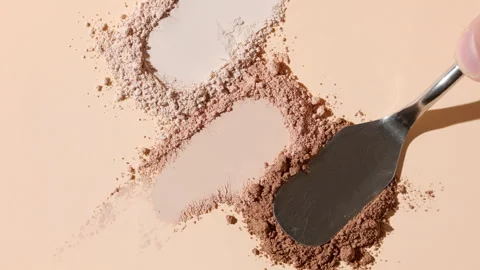 Close-up of three beige powder heaps for foundation campaign Stock Footage 336633748