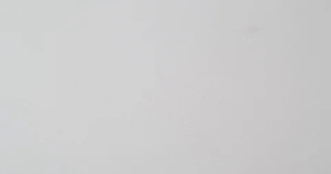 Close up of three bulldog clips falling into frame Stock Footage 117349655