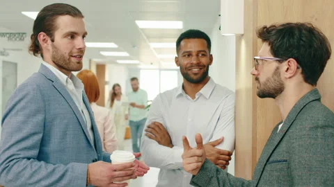 A close up of three business men with work clothes and beards having an Video stock 163817523
