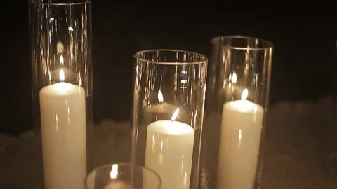Close up three candles burning in the night against the dark background. Stock Footage 164200454