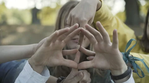 Close-up of three Caucasian hippies making peace sign with hands. Positive men Video stock 145017927