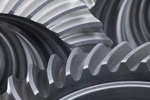 Close-up of three cog wheels in grey color Stock Photos