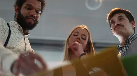 Close up of three colleagues discussing and shaking hands in agreement Stock Footage 59544450