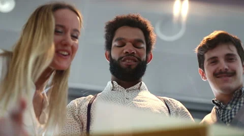 Close up of three colleagues discussing documents and business plan Stock Footage 59544437