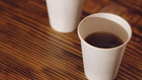 Close up of three cups of delicious coffee on the wooden table Stock-Footage 70267018