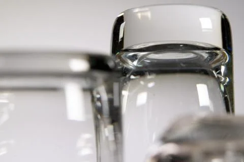 Close up of three empty shot glasses on white background. Foto stock
