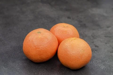 Close-up of  three fresh oranges on the table Foto stock