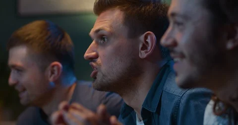 Close up of three handsome Caucasian friendly men drinking beer and cheering up Stock Footage 127124874