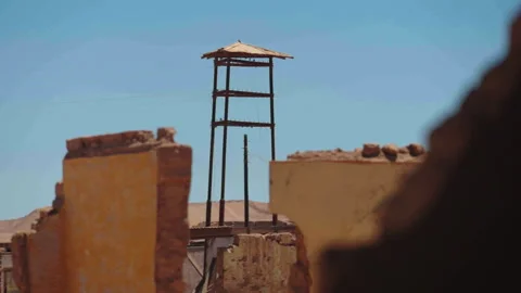 Close-up of three-legged watchtower at Chacabuco camp Vidéo 337874727