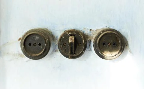 A close up of three old electrical switches Stock Photos