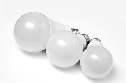 Close-up of three plastic  led bulb on a white background. Stock Photos