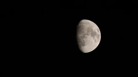 Close Up Of Three Quarter Moon In Black Sky Centre To Right Of Frame Stock Footage