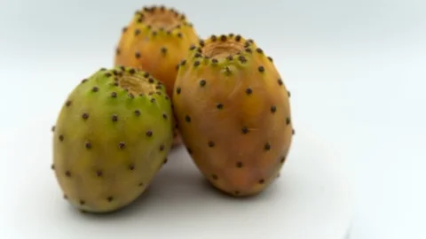 Close-up of three rotating ripe indian prickly cactus pears Stock Footage 116728400