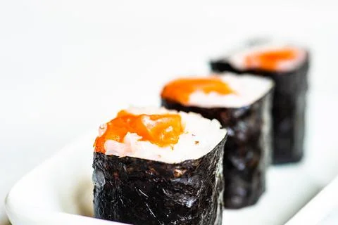Close-up of three sake maki rolls on a plate Stock Photos