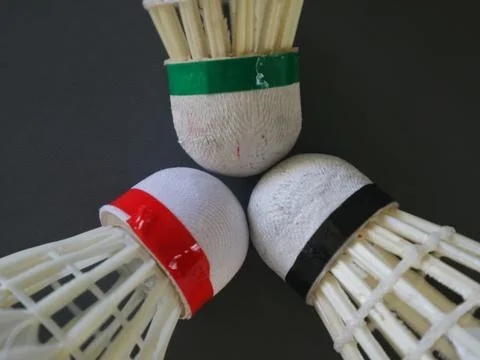 Close-up of three touching badminton shuttlecock heads Stock Photos