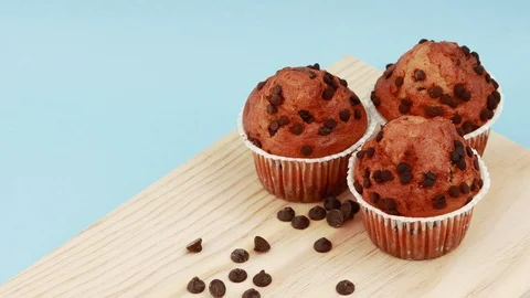 Close up of a three vegan muffins over a cutting board with copy space Stock Footage 129842555