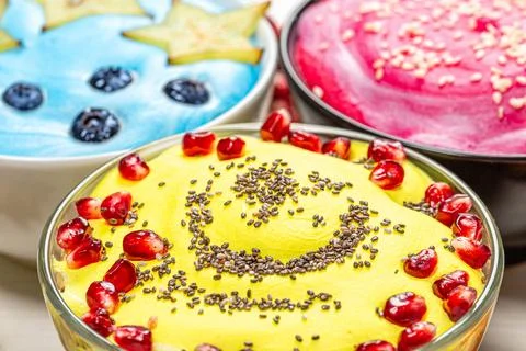 Close up of three versions of oatmeal with fruit and seeds Stock Photos