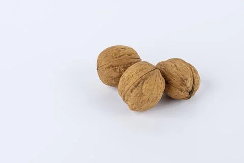 Close up of three walnuts isolated against white background Foto stock