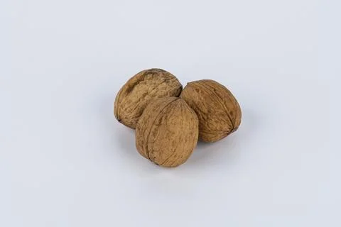 Close up of three walnuts isolated against white background Foto stock