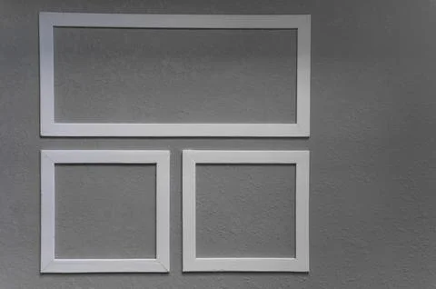 Close-up of three white picture frames Stock Photos