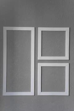 Close-up of three white picture frames Stock Photos