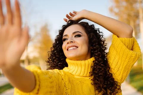 Close-up. throwing her head with delight looking up the girl stretched her hand Stock Photos