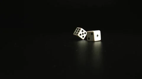 Close-up of Throwing Two Dice on black Table. The Concept of Gambling, Risk and Stock Footage 146316435