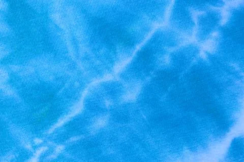 Close up tie dye fabric pattern. Hand made texture. Stock Photos