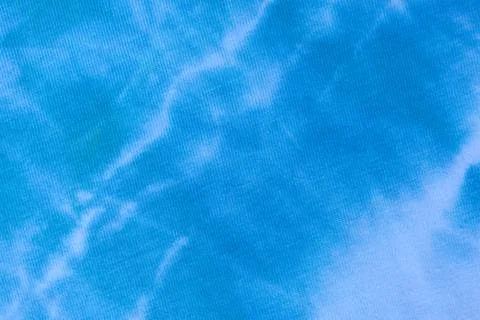 Close up tie dye fabric pattern. Hand made texture. Stock Photos