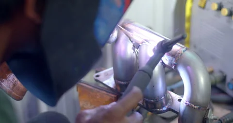 Close up tig welding.Car header pipe welding.Automotive exhaust pipe welding. Stock Footage 296338279