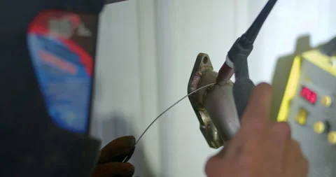 Close up tig welding.Car pipe welding.The hand of a mechanic or welder is fixing Stock Footage 287942387