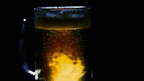 Close Up Tight Rotating Beer in Mug, Backlit Only 動画素材 93972181