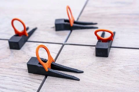 Close-up of the tile alignment system holding tile in given position Stock Photos