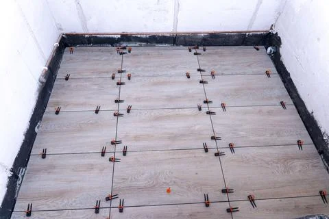 Close-up of the tile alignment system holding tile in given position Stock Photos