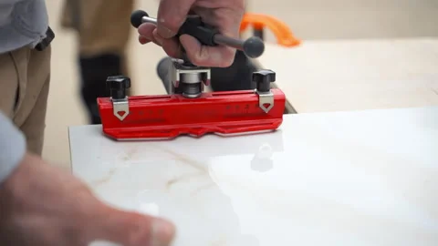 Close-up of an tile cutting tile surface. precision cutting, professional Stock Footage 335949755