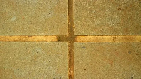 Close-up of tiled stone floor with grout lines Stock Photos