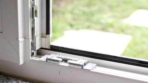 Close Up of Tilt and Turn Window Lock Fitting, Plastic Window Frame, Macro Shot Video stock 341526707