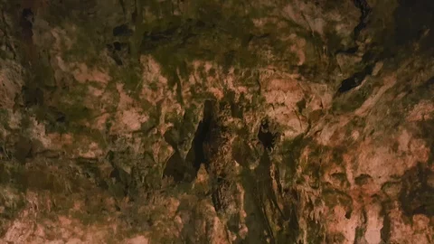 Close up tilt down ancient rock formation drapes on the wall of Saeva Cave Stock Footage 86339156