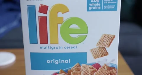 Close Up Tilt Down of a Box of Life Cereal Stock Footage 174536705