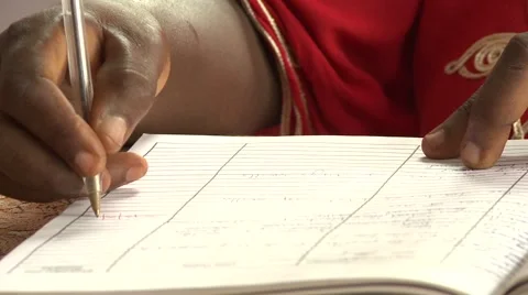 CLOSE UP: TILT DOWN FROM HEADMISTRESS TO PAPERWORK Stock Footage 60115968
