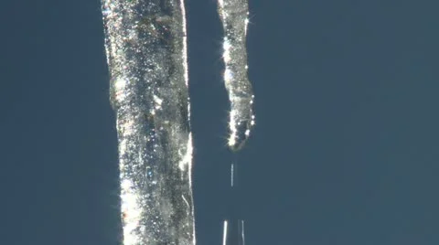 Close tilt down over dripping ice Stock Footage 10821547